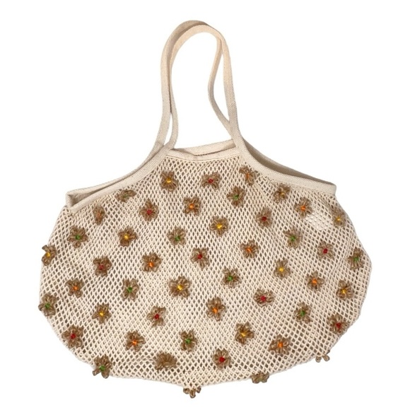 Urban Outfitters Handbags - Urban outfitters- Knit bag with flowers never used